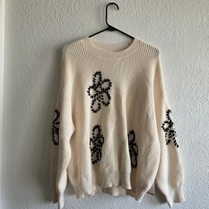 Cyrus Cream Sweater with Black Floral Accents